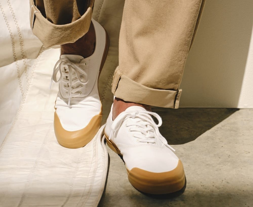 man wearing white todd snyder sperry shoes