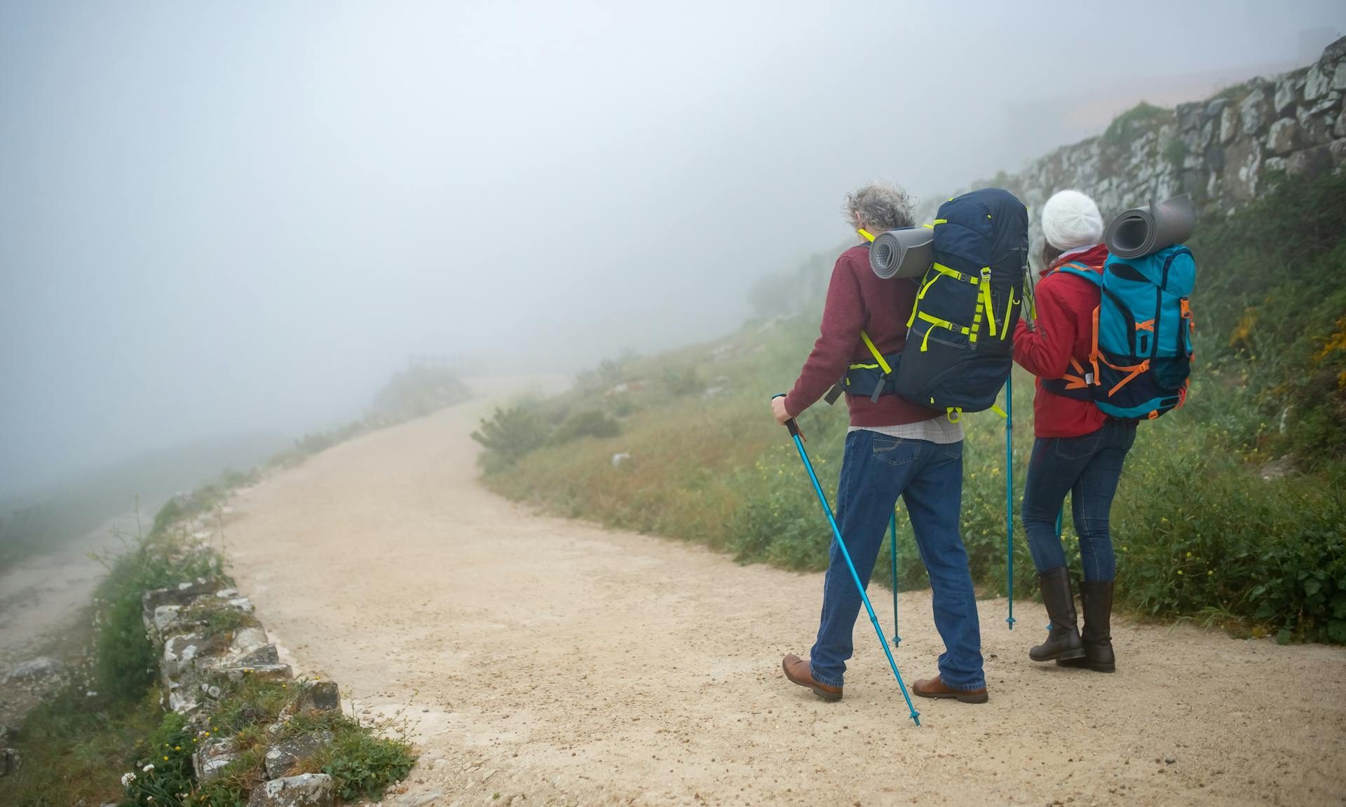 two people with hiking poles