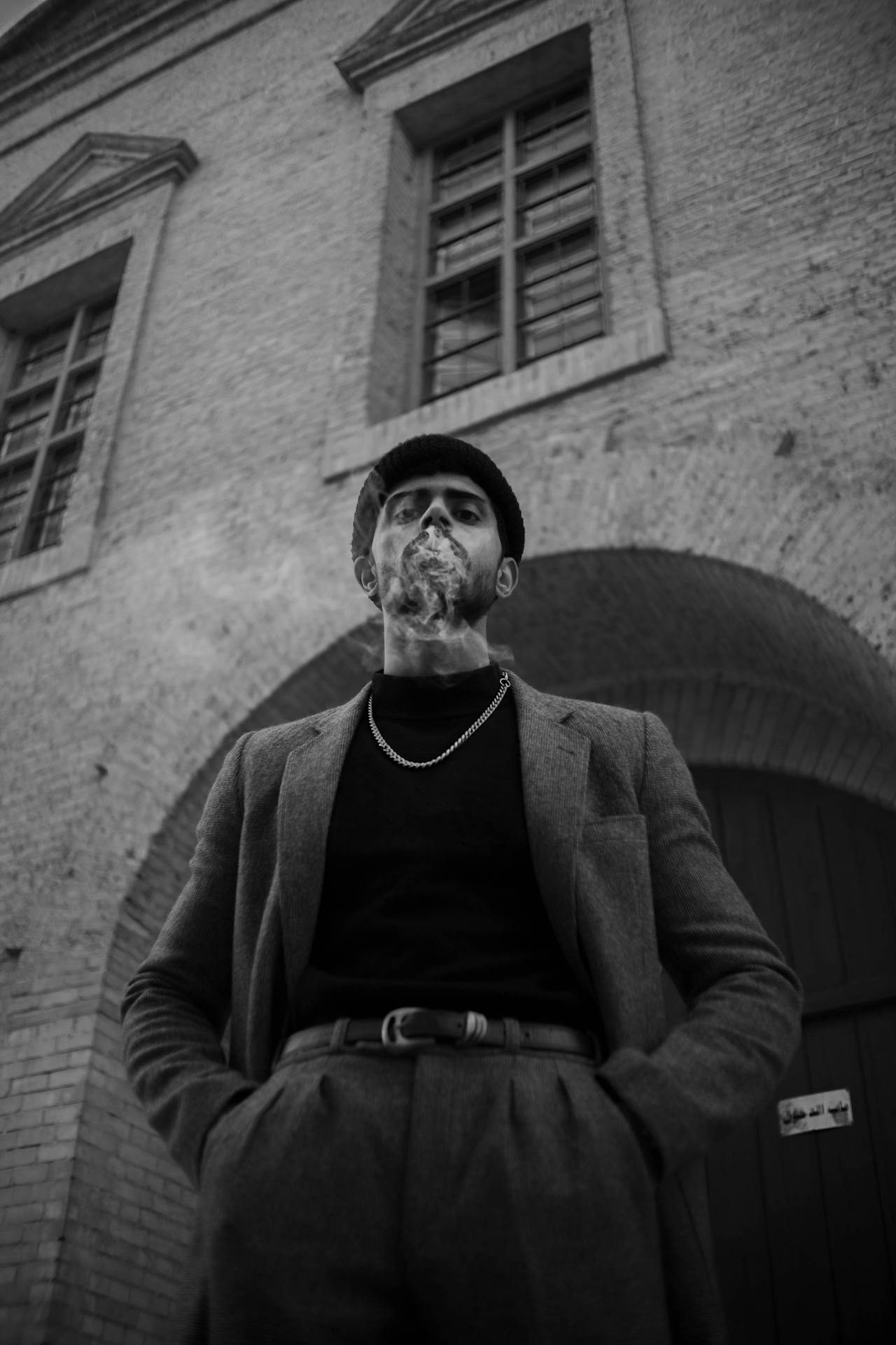 a young man smoking a cigar