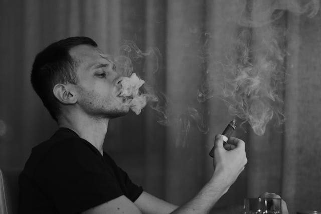 a man smoking a cigar