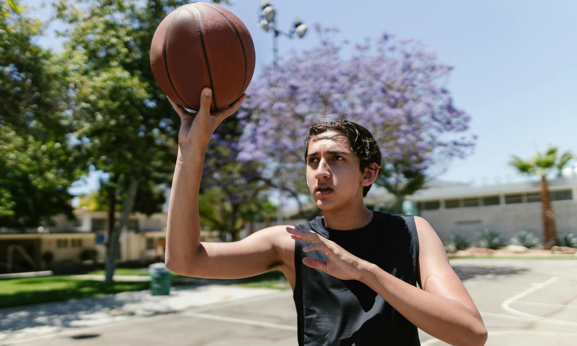 teen playing basketball