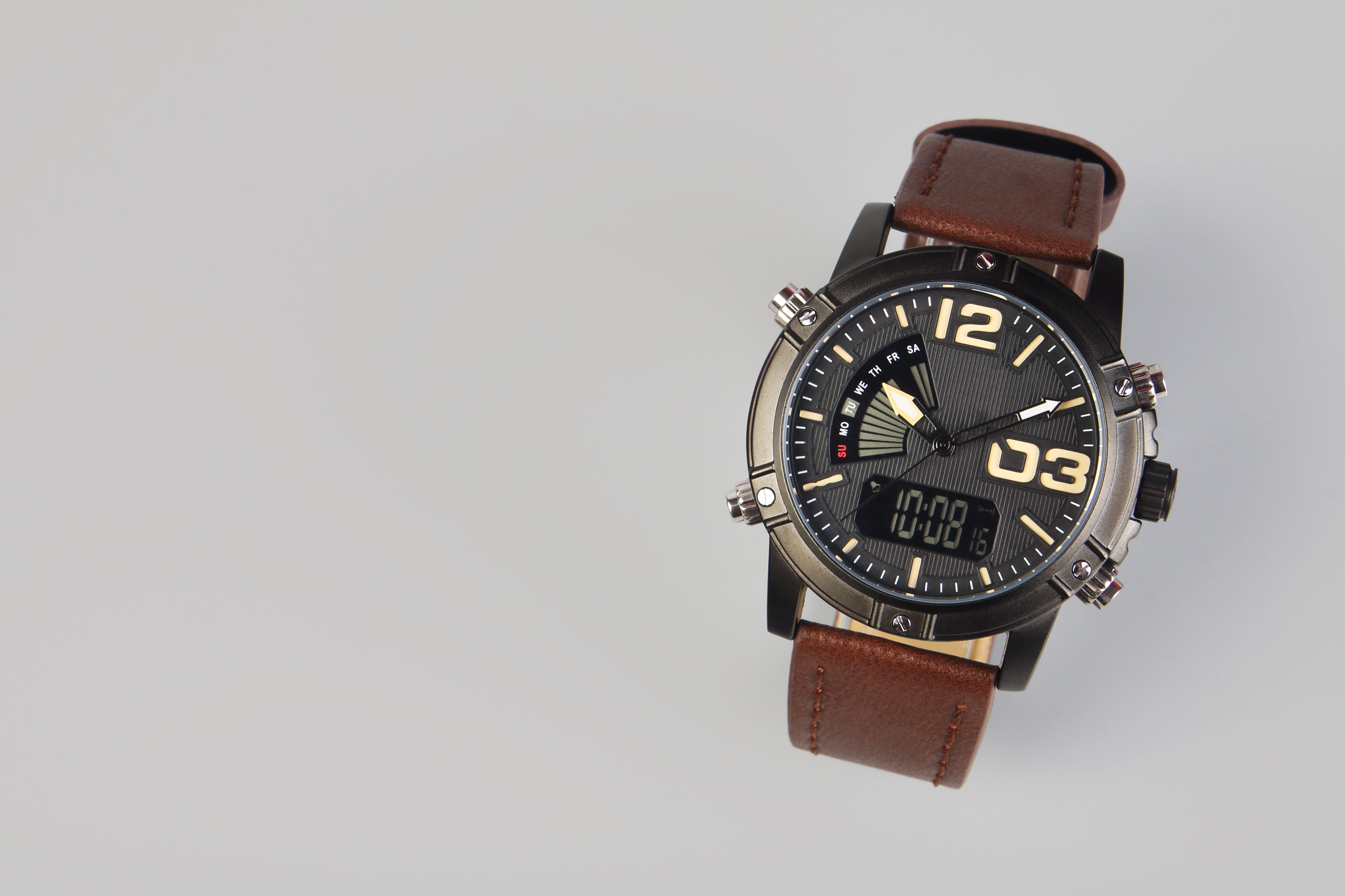 Men's wrist watch on gray background