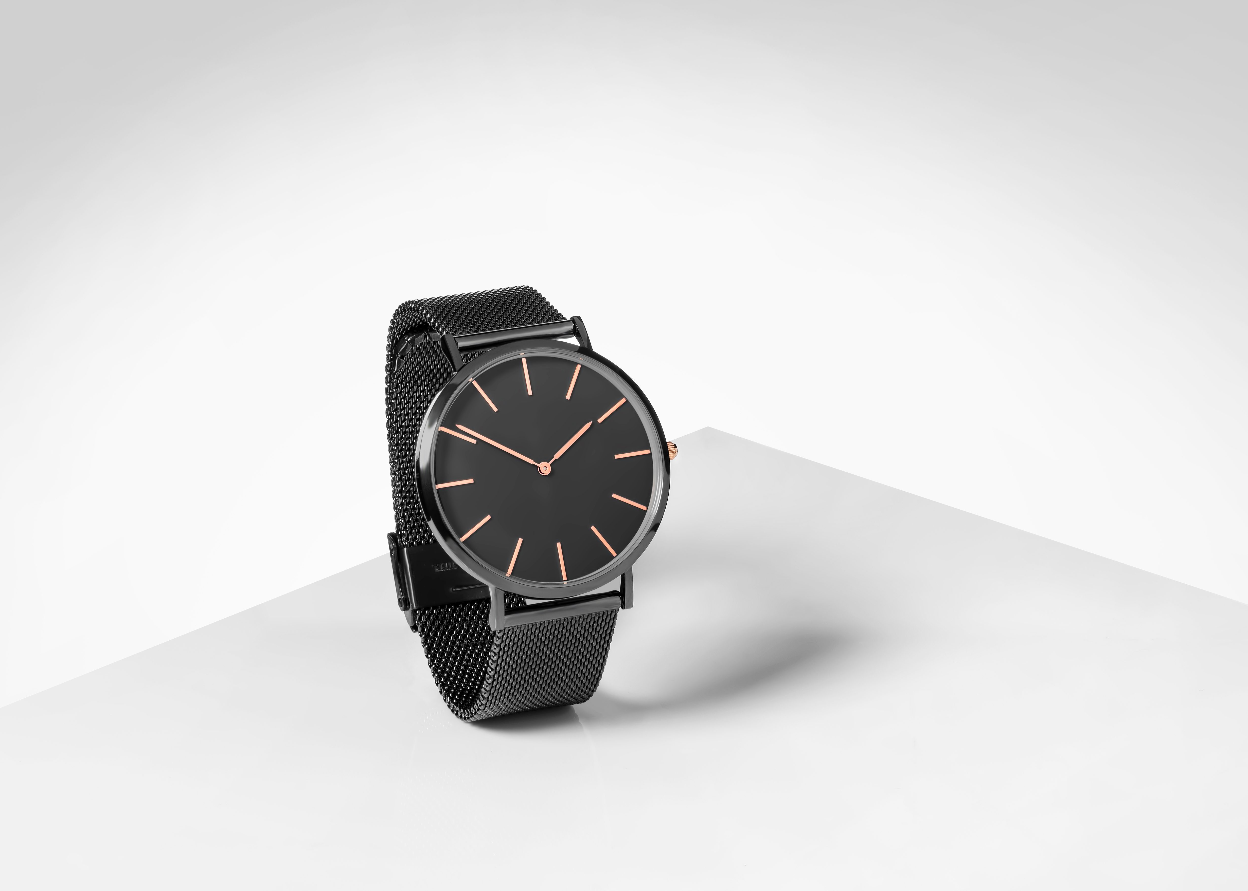 Men's wrist watch with white background.