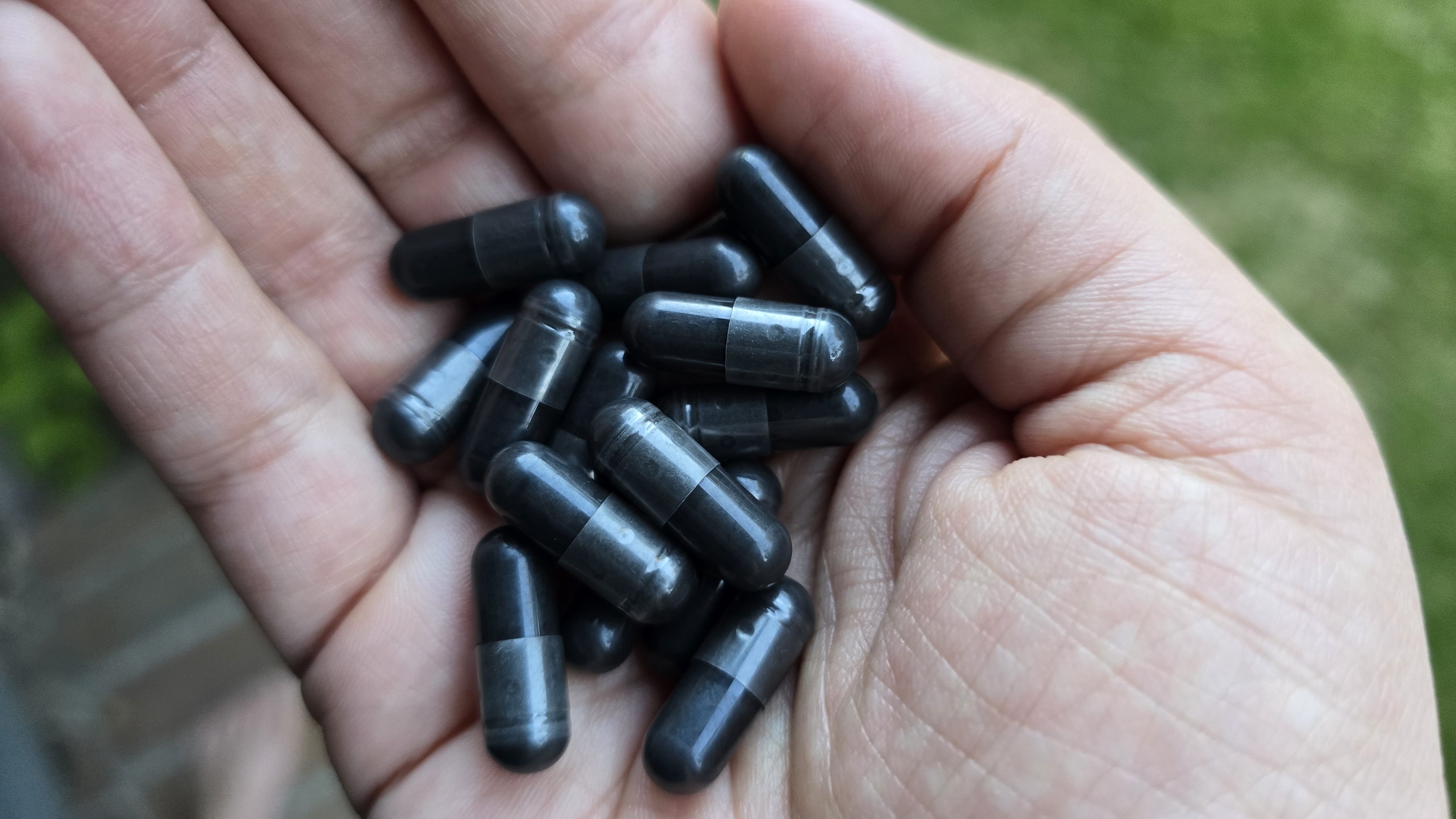 Rachel Dennis holding charcoal capsules