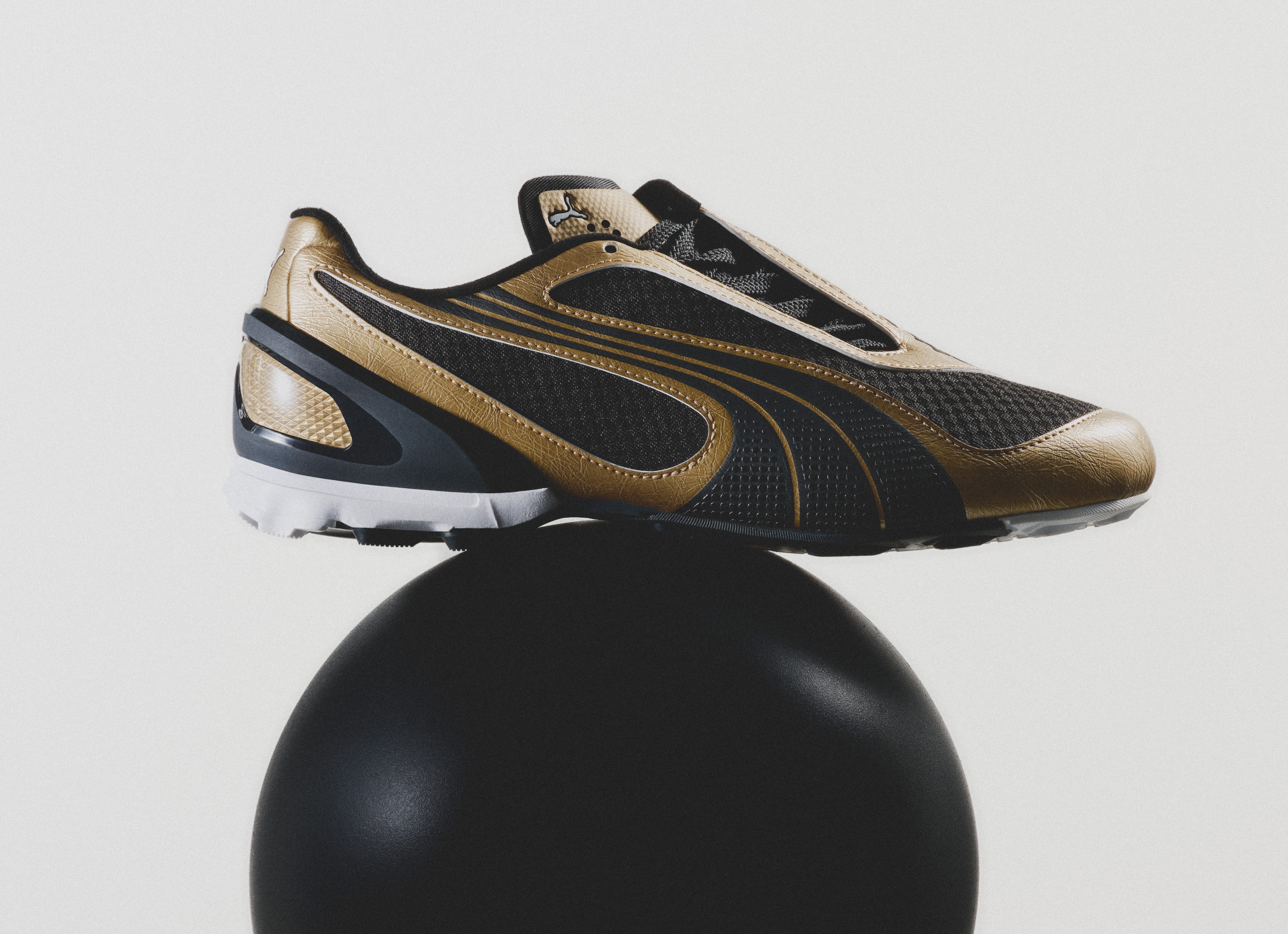 puma v-s1 sneaker on top of ball