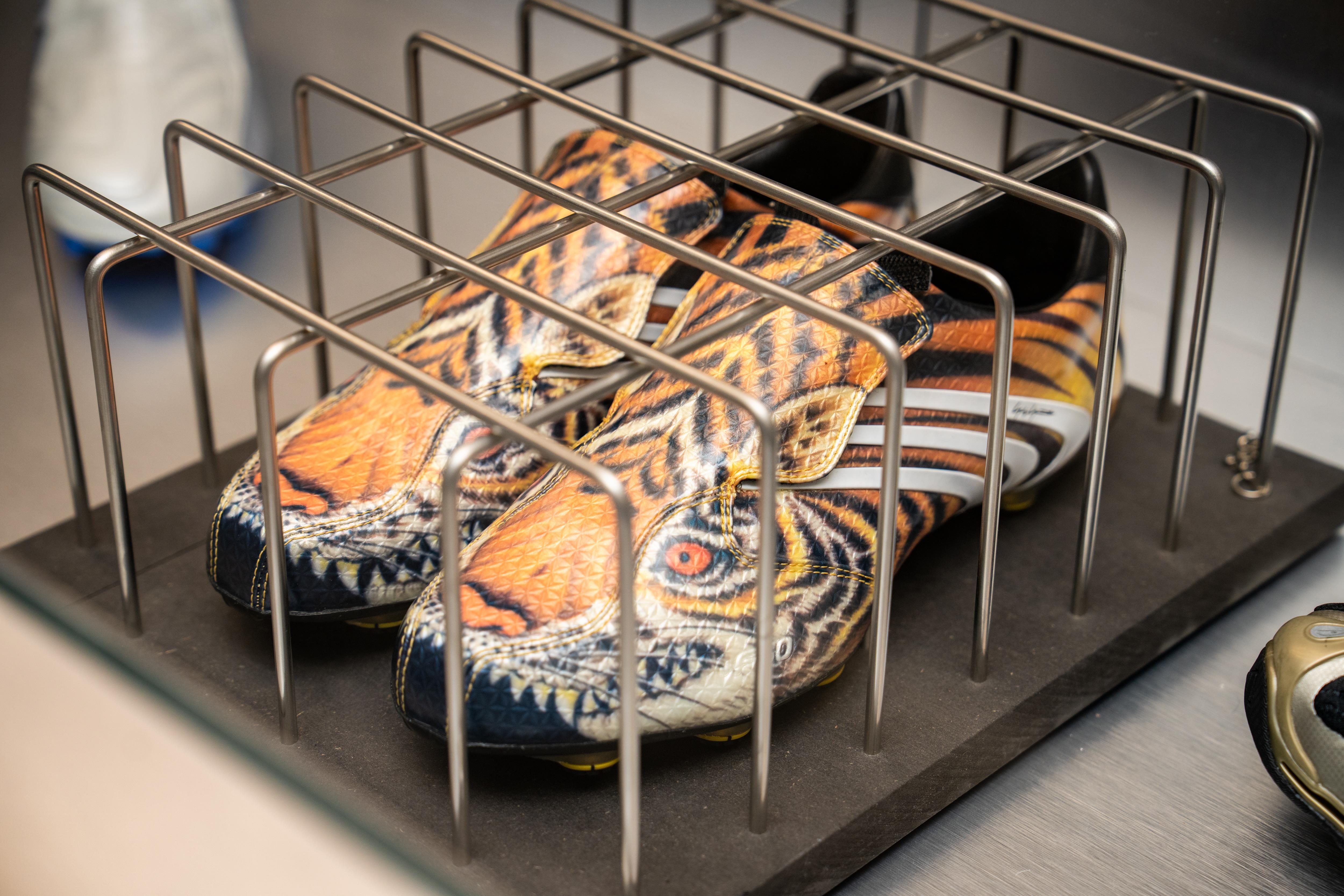 adidas sneakers in a cage