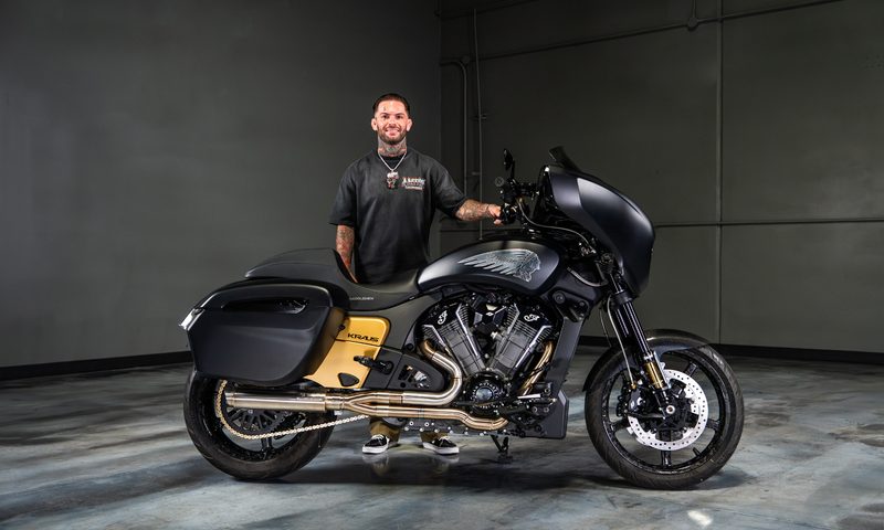 Cody Garbrandt standing behind his KRAUS customized 2025 Indian Chieftain PowerPlus motorcycle.