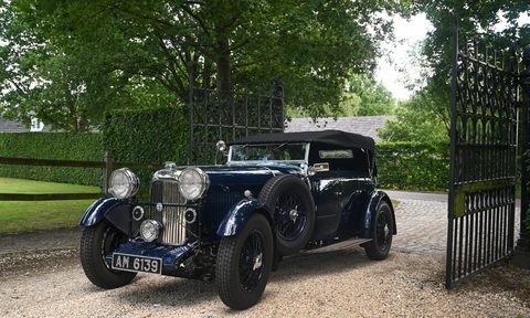 F1 legend Bernie Ecclestone 1934 Lagonda left front three quarter view entering an estate
