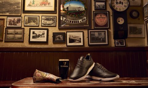 travismathew x guinness shoe in pub next to guinness