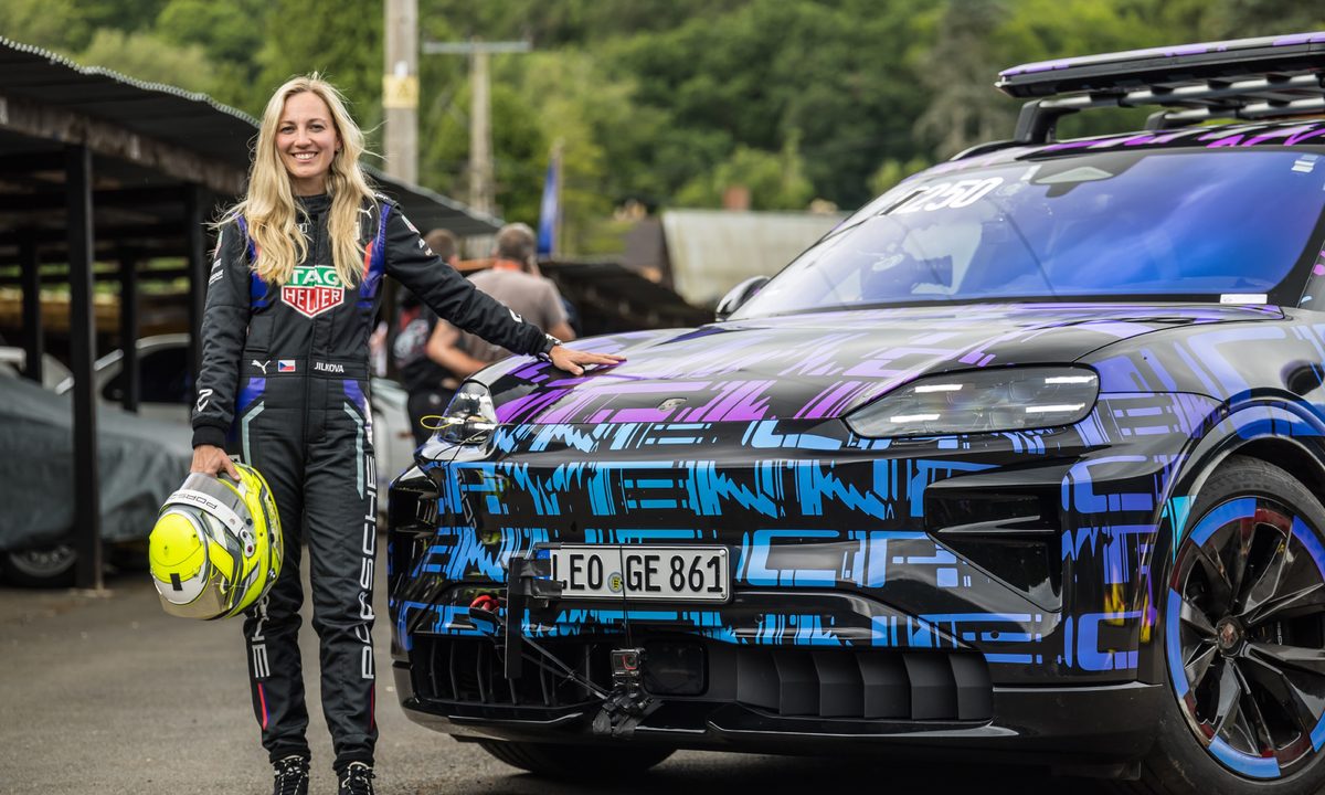 Gabriela Jílková, simulator and development driver for the TAG Heuer Porsche Formula E Team with camoflagued Porsche Cayenne Electric.