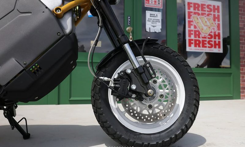 LiveWire previews 125cc equivalent EV street motorcycle close up of front wheel, tire, suspension, and brake.