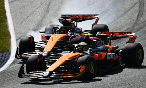 McLaren F1 racecars getting too close during a Grand Prix.