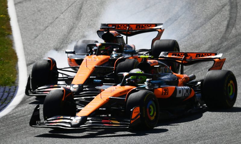 McLaren F1 racecars getting too close during a Grand Prix.