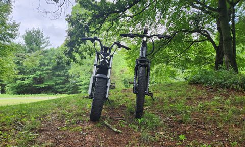 Segway Xber and Xafari front view parked on a hill with lights on.