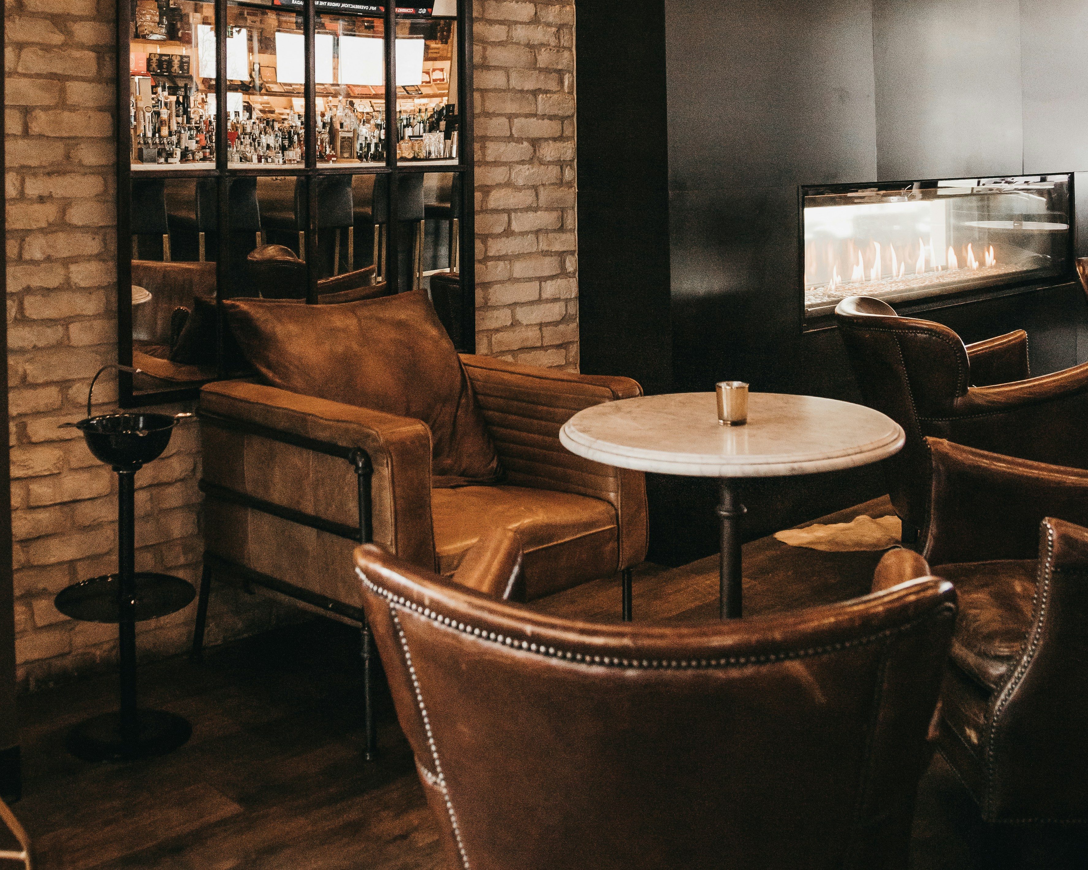 a lounge with a fireplace