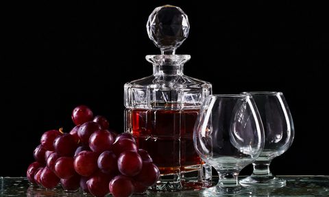 Whiskey decanter and grapes