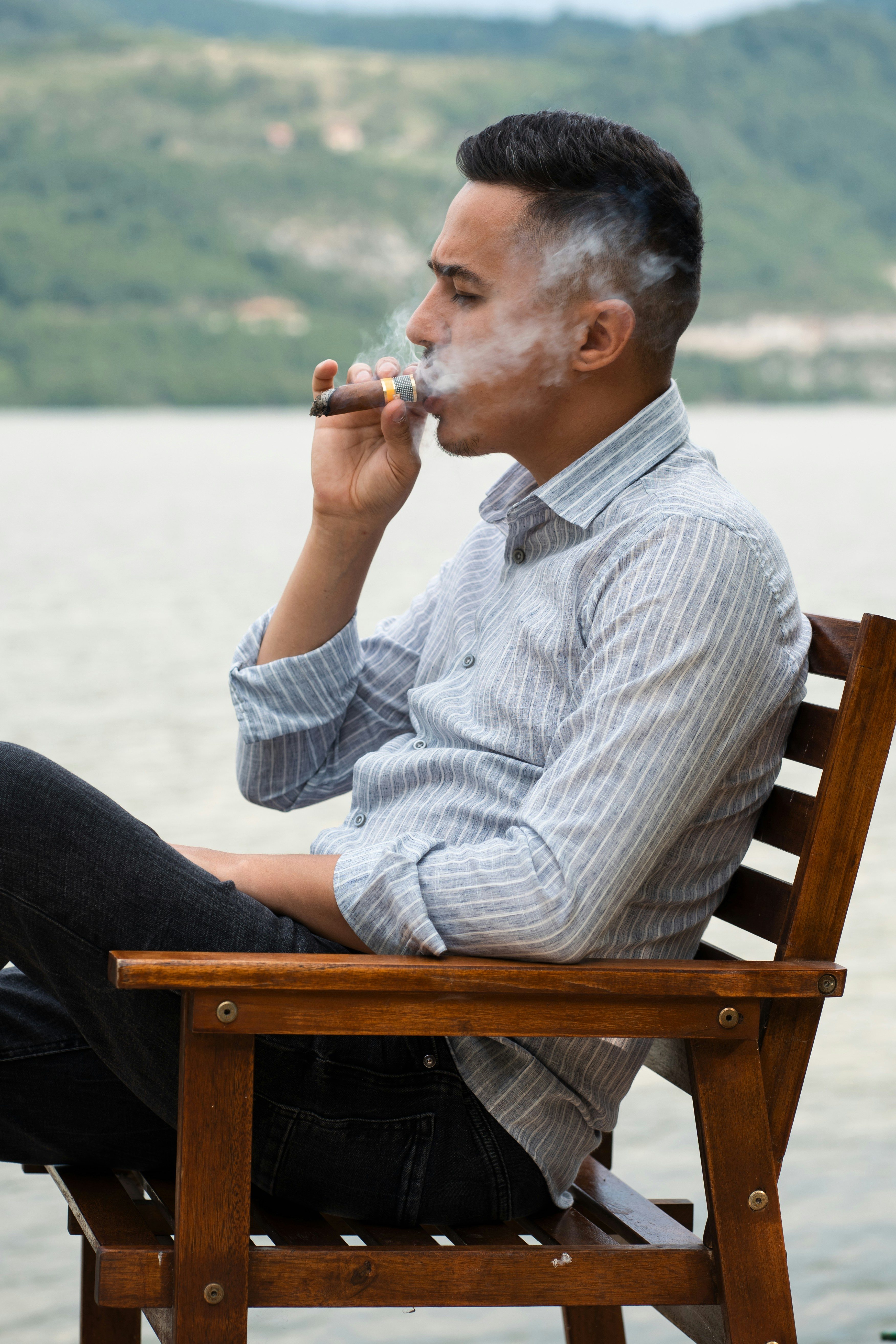 guy smoking cigar in the wind