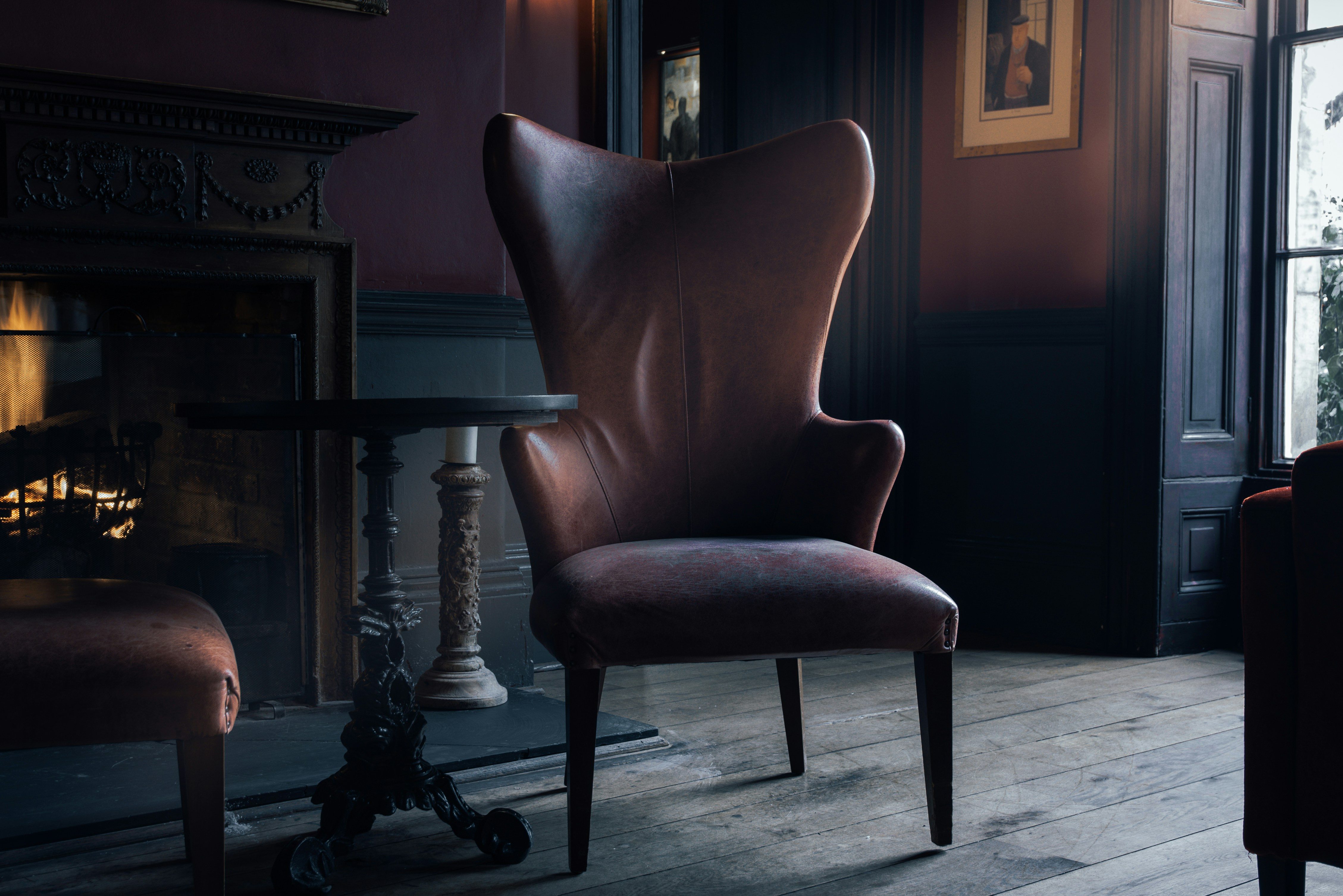 a lounge chair near pedestal table