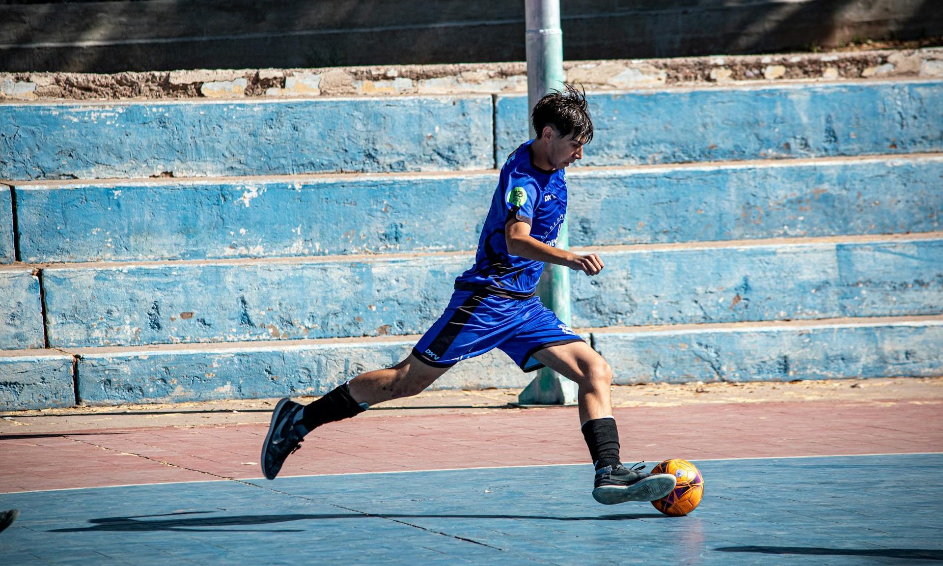 A teen playing football