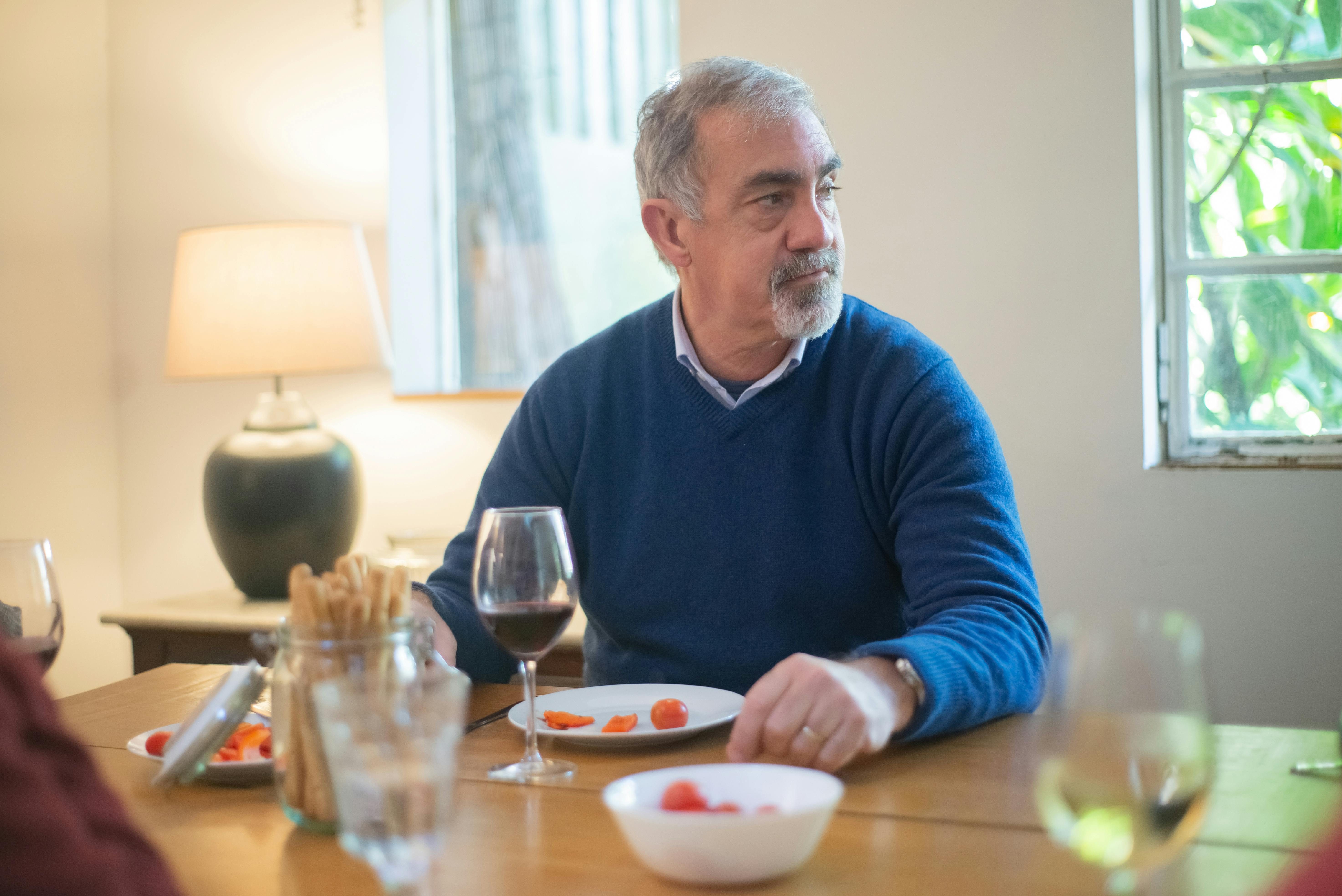 Older man eating.