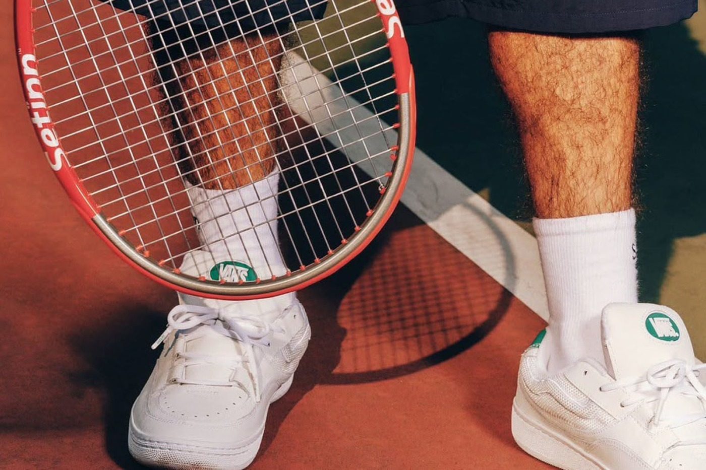 man wearing setinn x vans sneaker