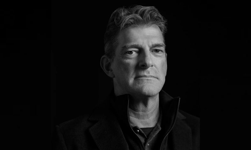 Cadillac F1 Team Principal Graeme Lowdon headshot in with black background.