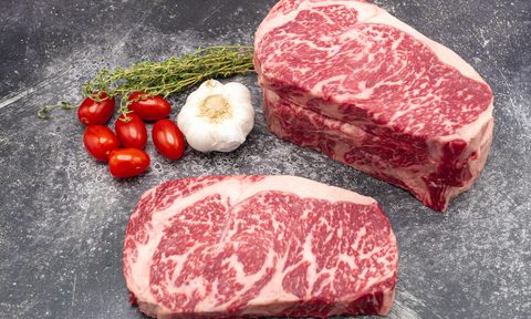 Two Mishima ribeye steaks on counter