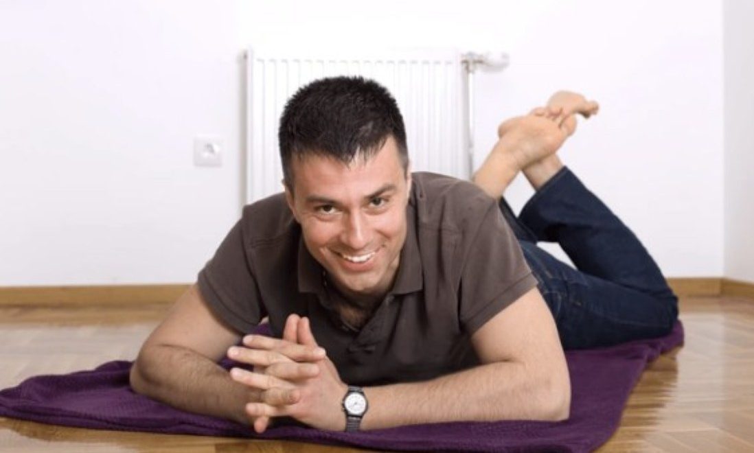 man laying on front tummy time