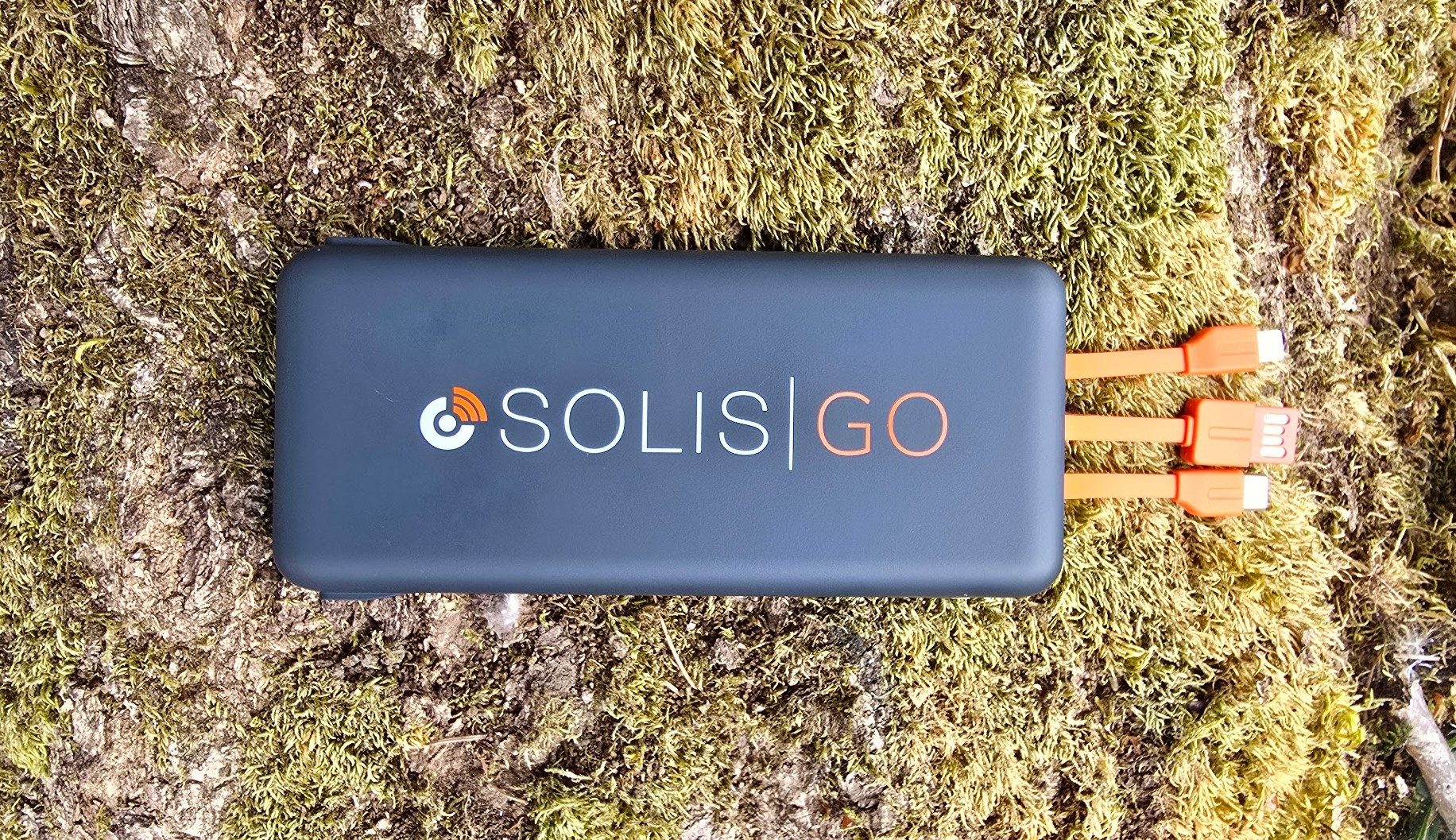 Solis Go device with charging cords on the ground