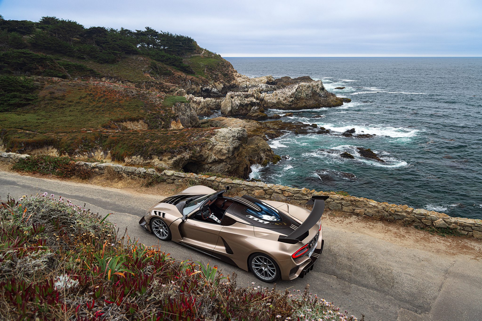 Top down view of a Venom F5 LF on a coast road
