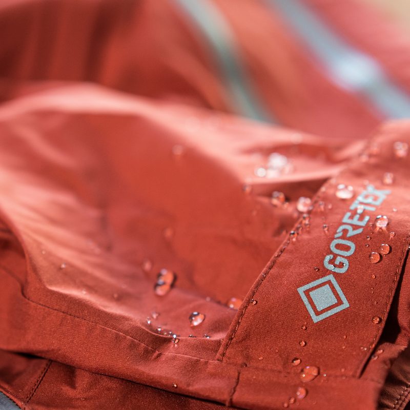 Detail photo of a waterproof gore-tex jacket with water droplets on it