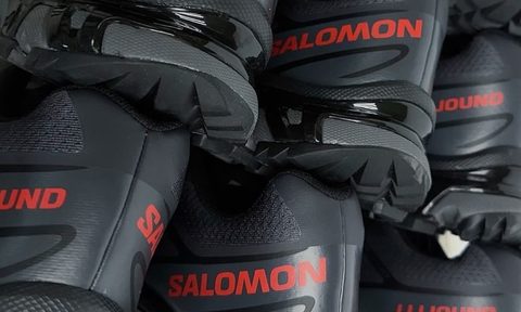 pile of black salomon sneakers