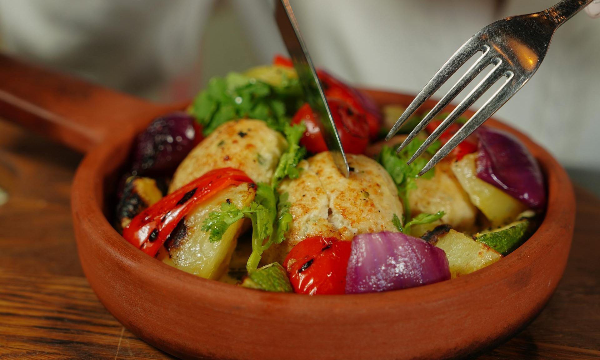 protein dish meat veggies knife fork