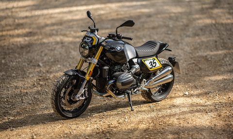 2026 BMW R 12 NineT with Tracker package parked on gravel left front three quarter view.