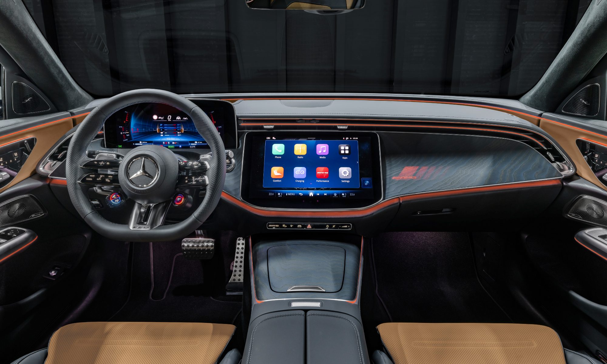 2026 Mercedes AMG E 53 Hybrid wagon cockpit view of the front seats, dashboard, and console.
