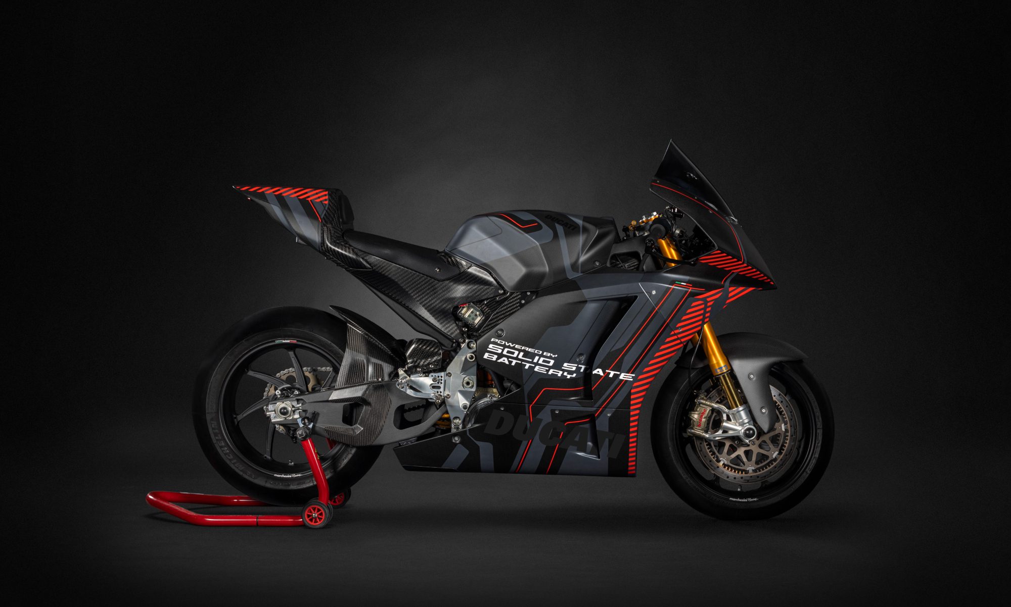 Ducati Bike powered by solid state battery technology concept on a stand right profile.