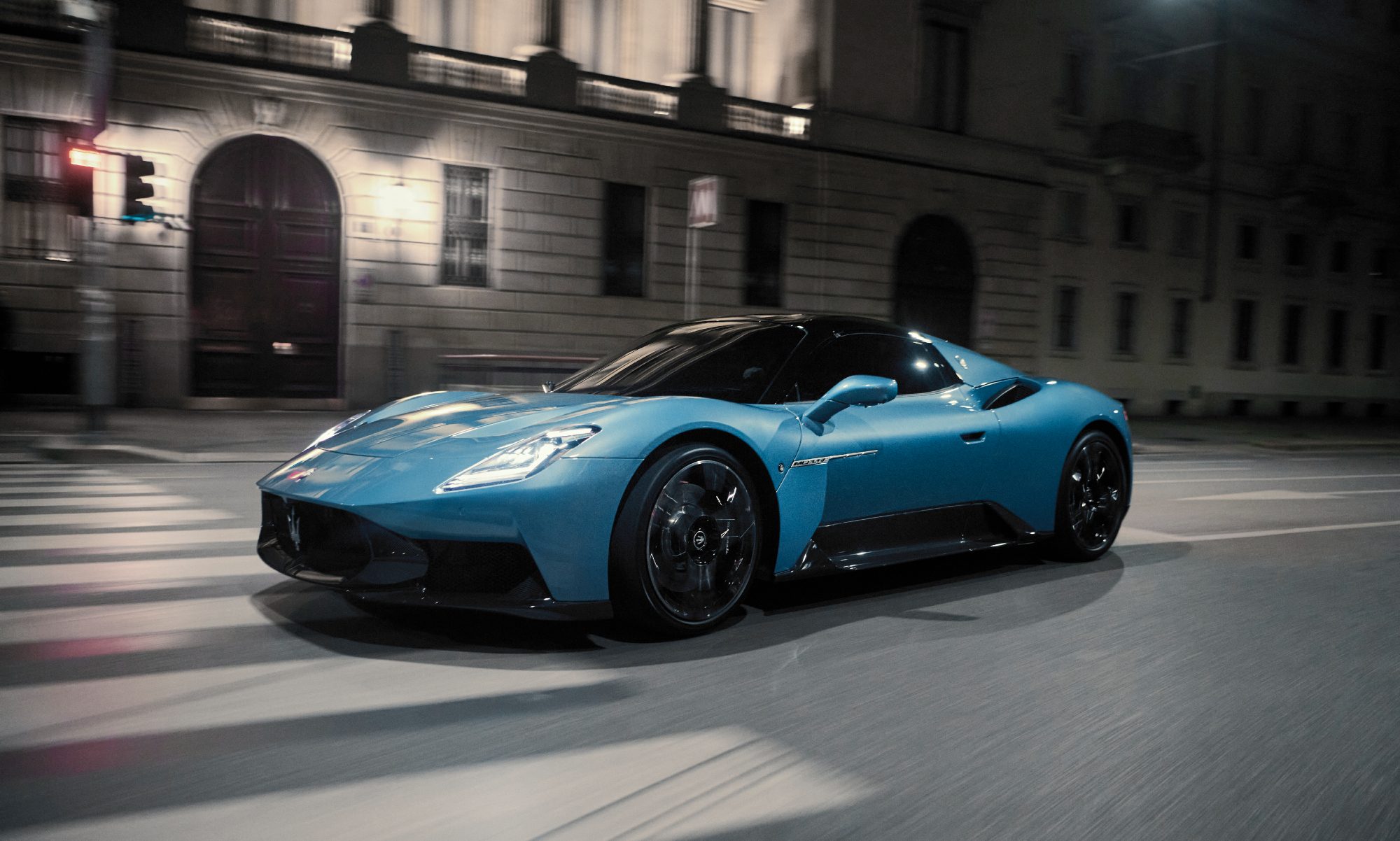 Maserati MCPURA Cielo on a city street at night left front three quarter view.