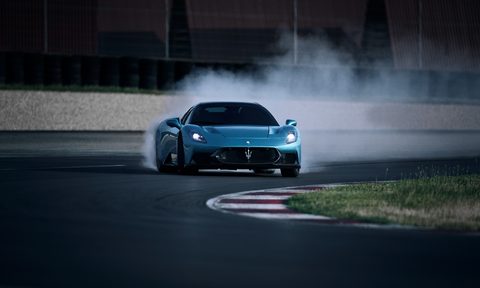 Maserati MCPURA on a racetrack oversteering into a left hand turn.
