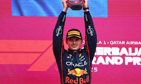 Max Verstappen holding first place trophy for Azerbaijan Grand Prix.