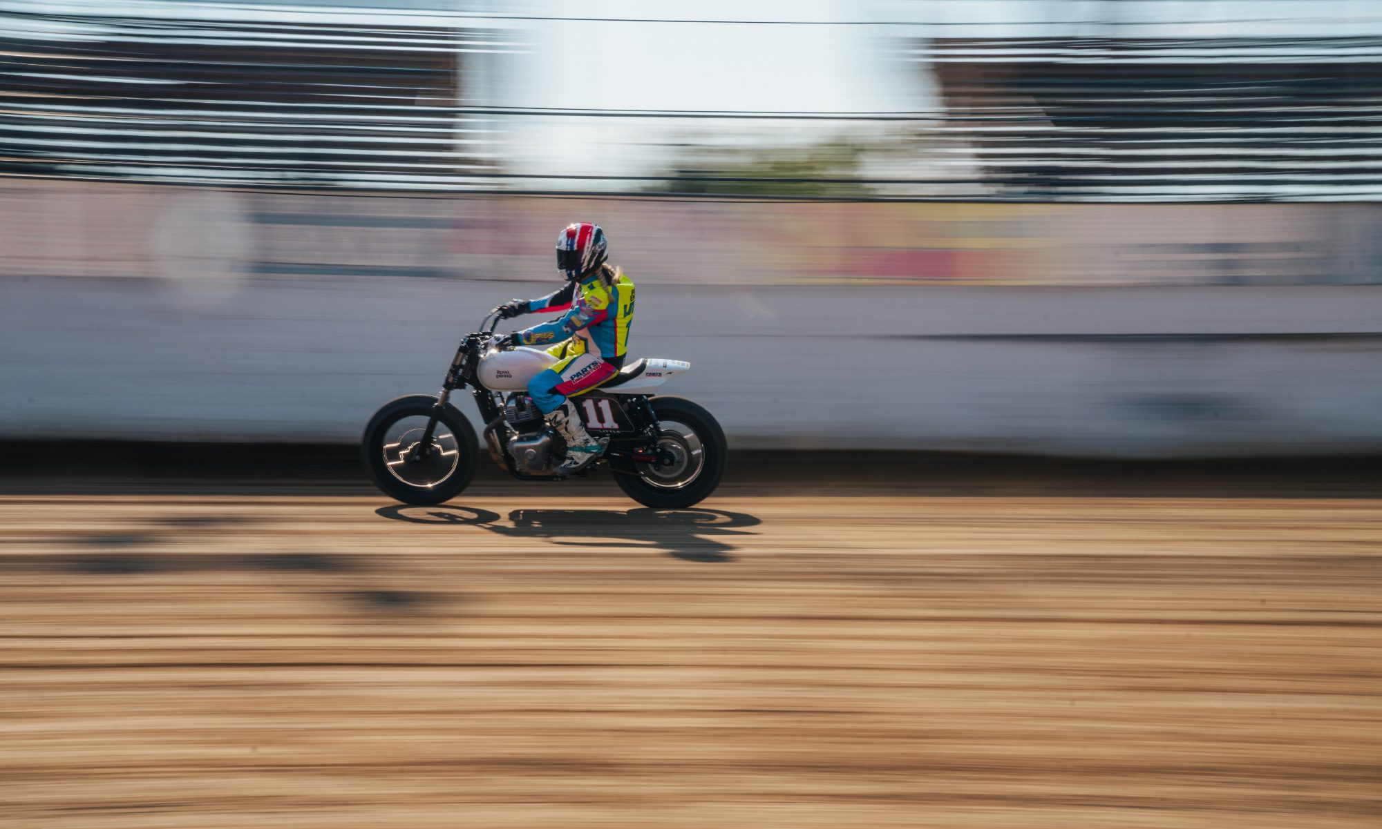 Taia Little riding in the Ozark BTR Flat Track race left side profile.