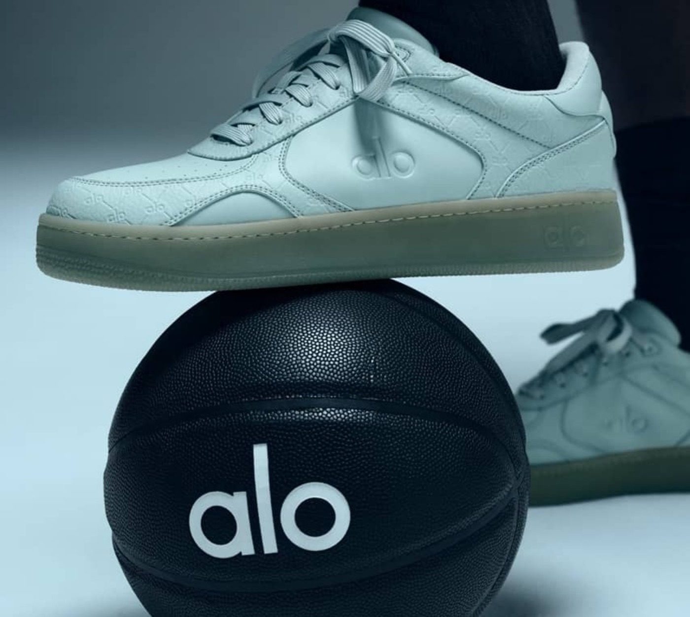 white alo sneaker on alo basketball