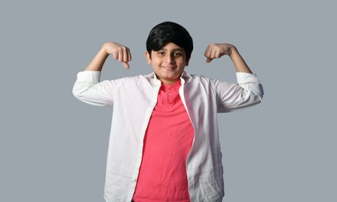 kid flexing muscles