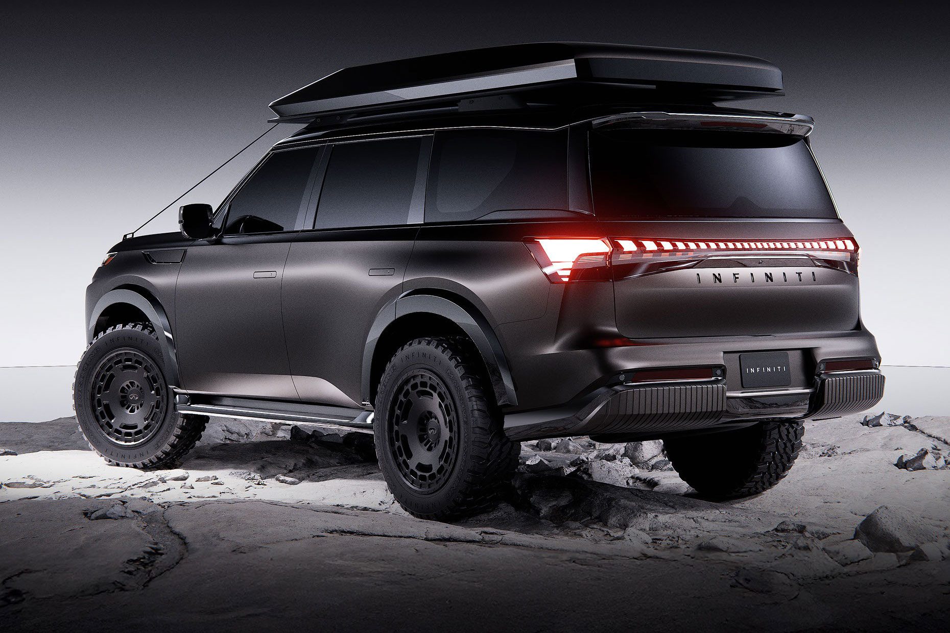 Rear 3/4 view of Infiniti's 2026 QX80 Terrain Spec concept overlanding SUV.