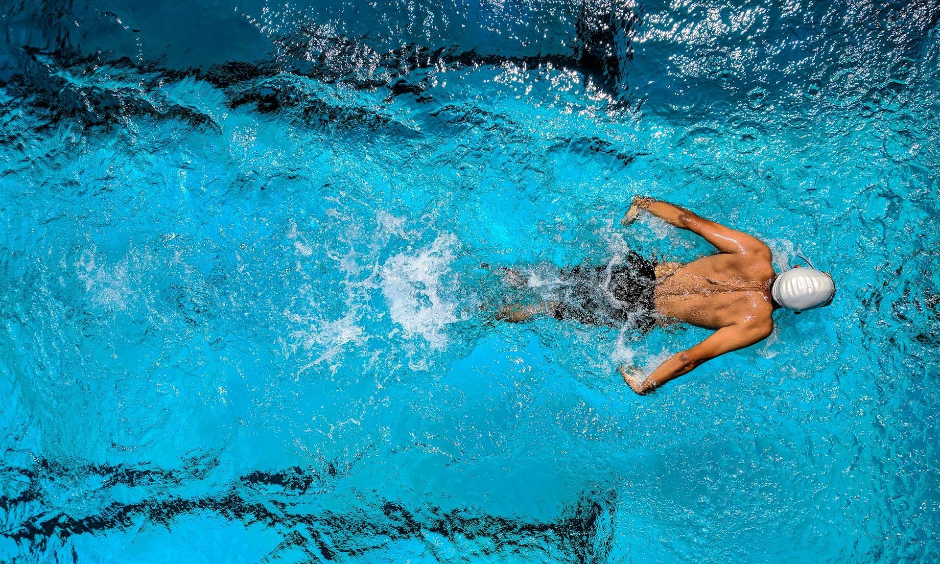 man swimming in the pool