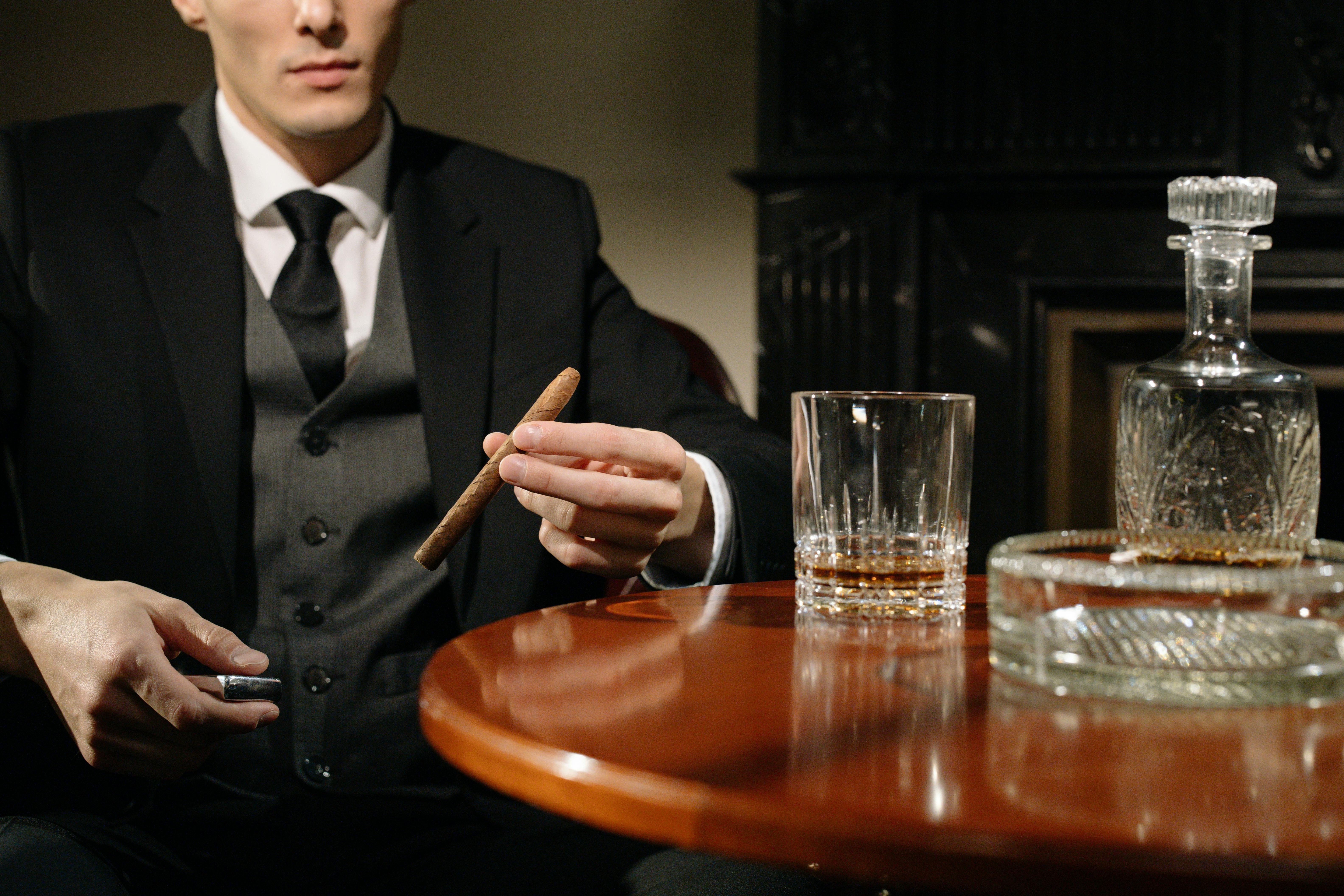 man holding a cigar