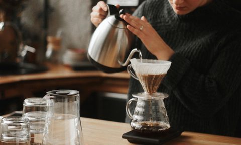 woman pouring coffee