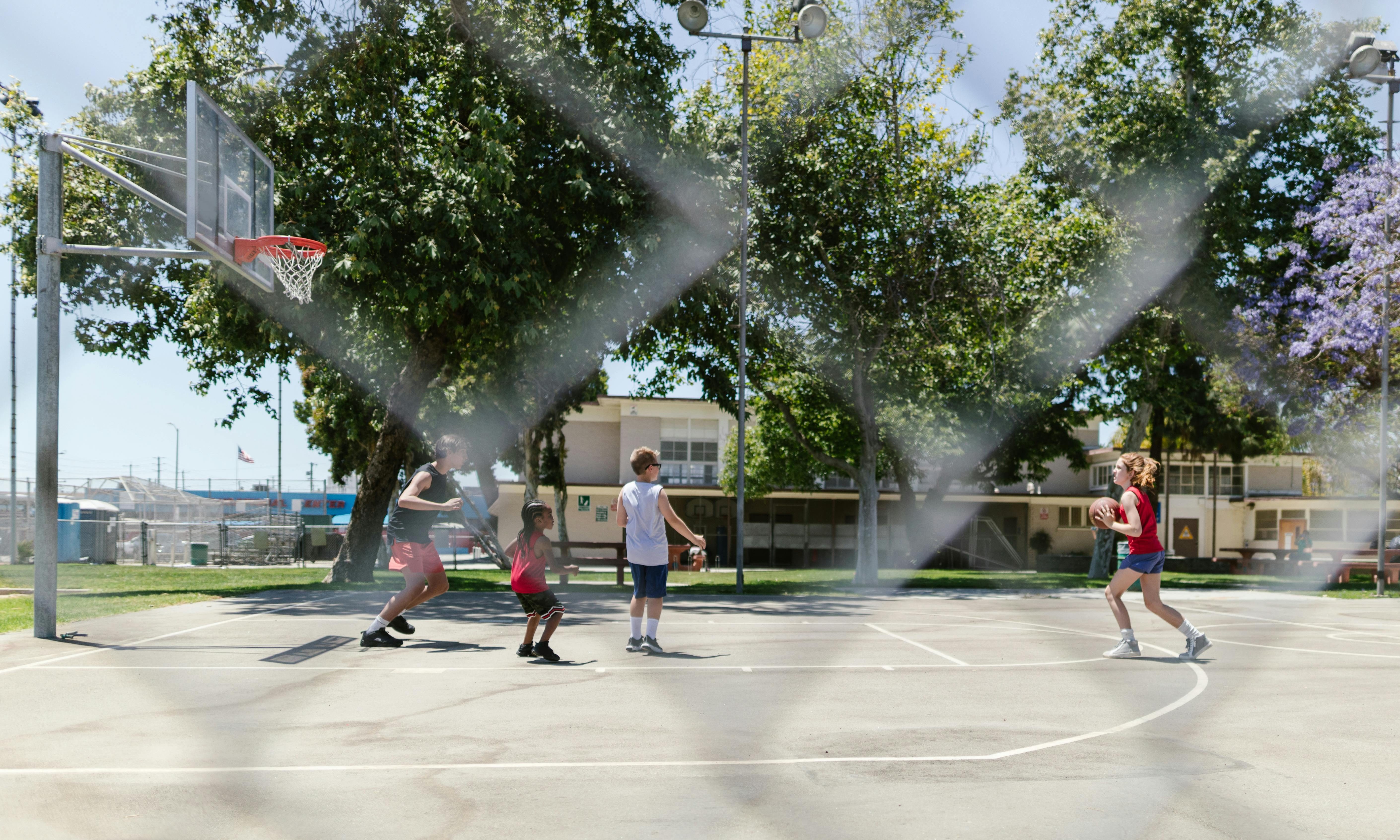 family kids playing basketball