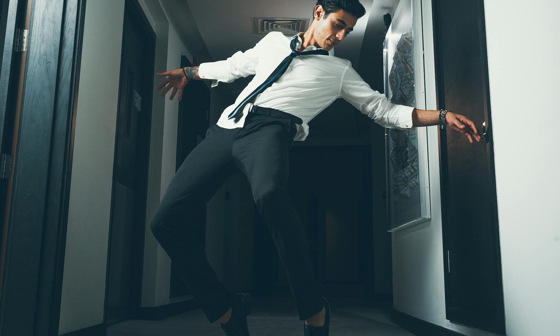man dancing in suit