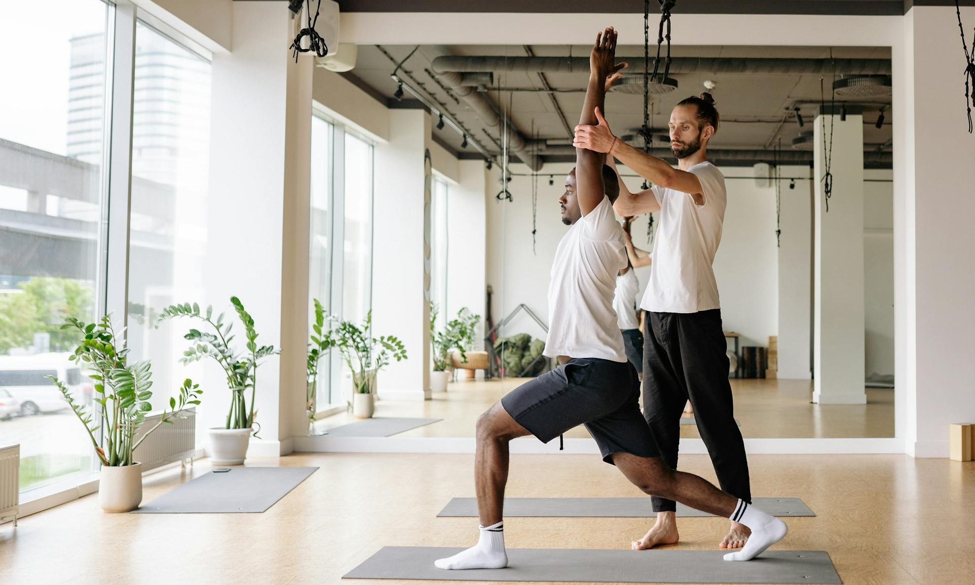 pexels-yankrukov-men exercising yoga stretching