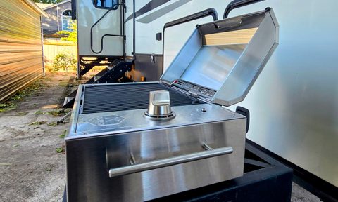 A Kenyon City Grill in front of an RV